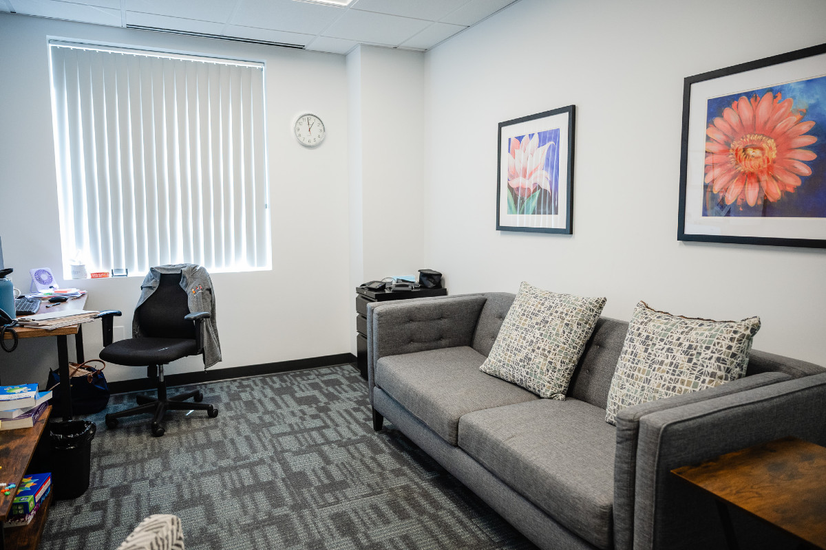 a comfortable yet empty room with a couch