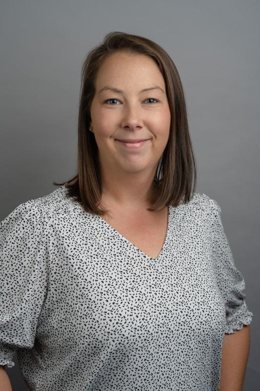 a headshot of a woman smiling